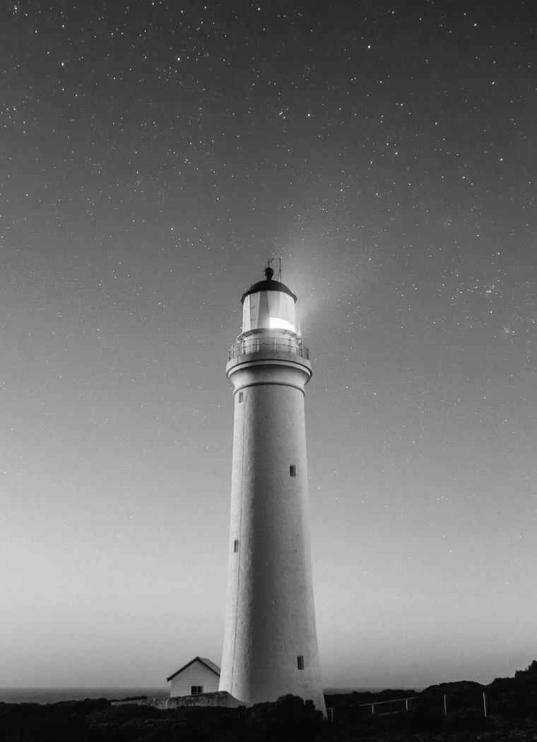 Lighthouse standing above the sea